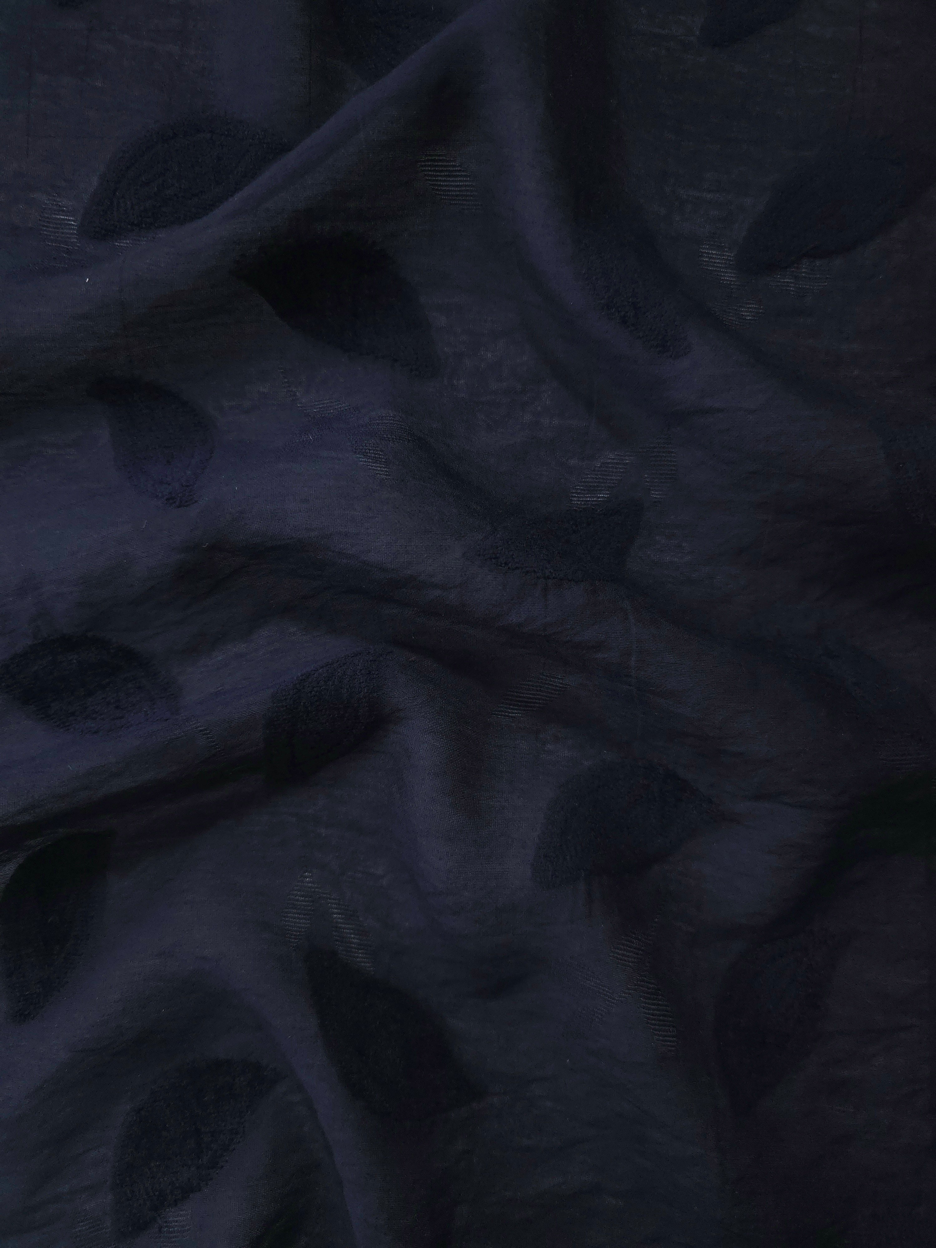 Front and back view of dark blue leaf embossed viscose jacquard fabric.