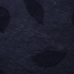 Drape view of dark blue leaf embossed viscose jacquard fabric for layered dresses.