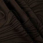Brown branch polyester crepe jacquard fabric pattern detail with raised texture for dresses.