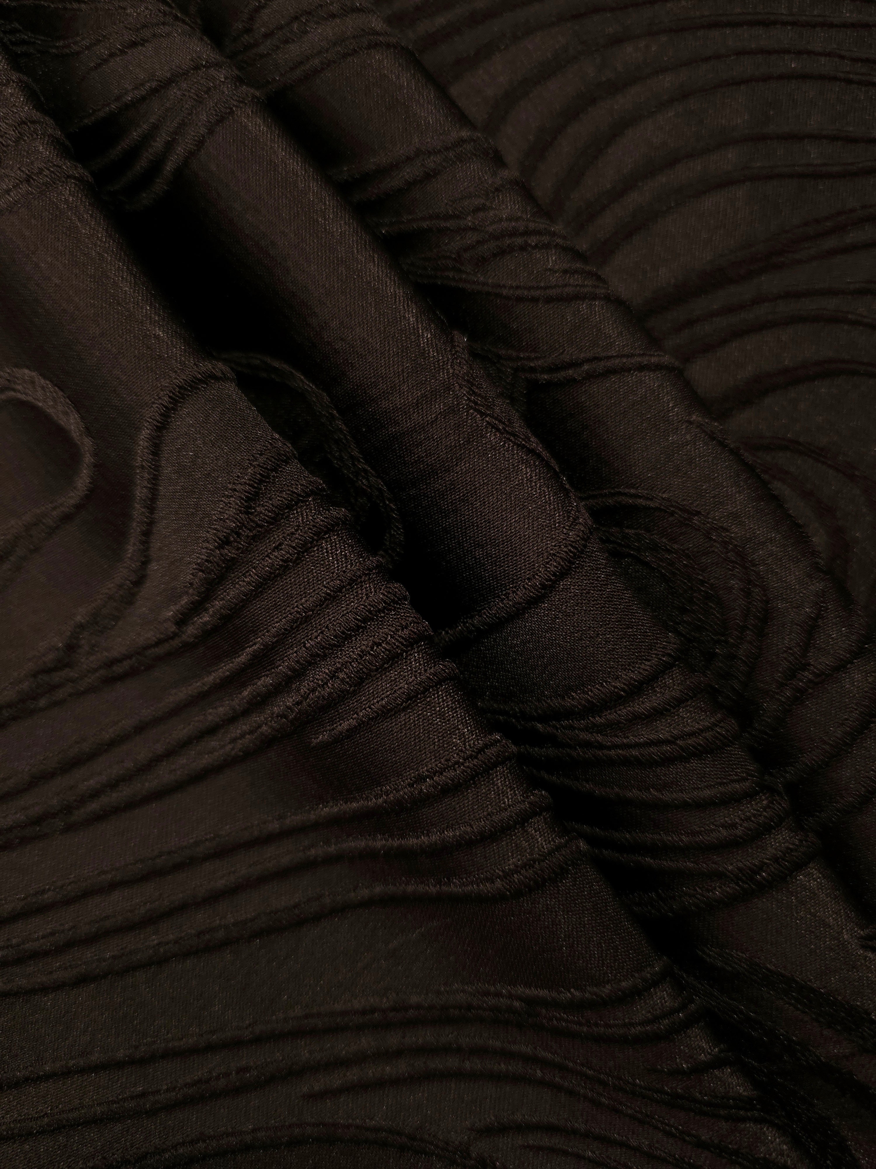 Brown branch polyester crepe jacquard fabric pattern detail with raised texture for dresses.