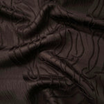 Brown laurel polyester crepe jacquard fabric in a textured drape for dresses and jackets.