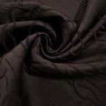 Wide view of brown laurel polyester crepe jacquard fabric for tailored modestwear layers.