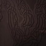 Closeup texture of brown laurel polyester crepe jacquard fabric for structured dress layers.
