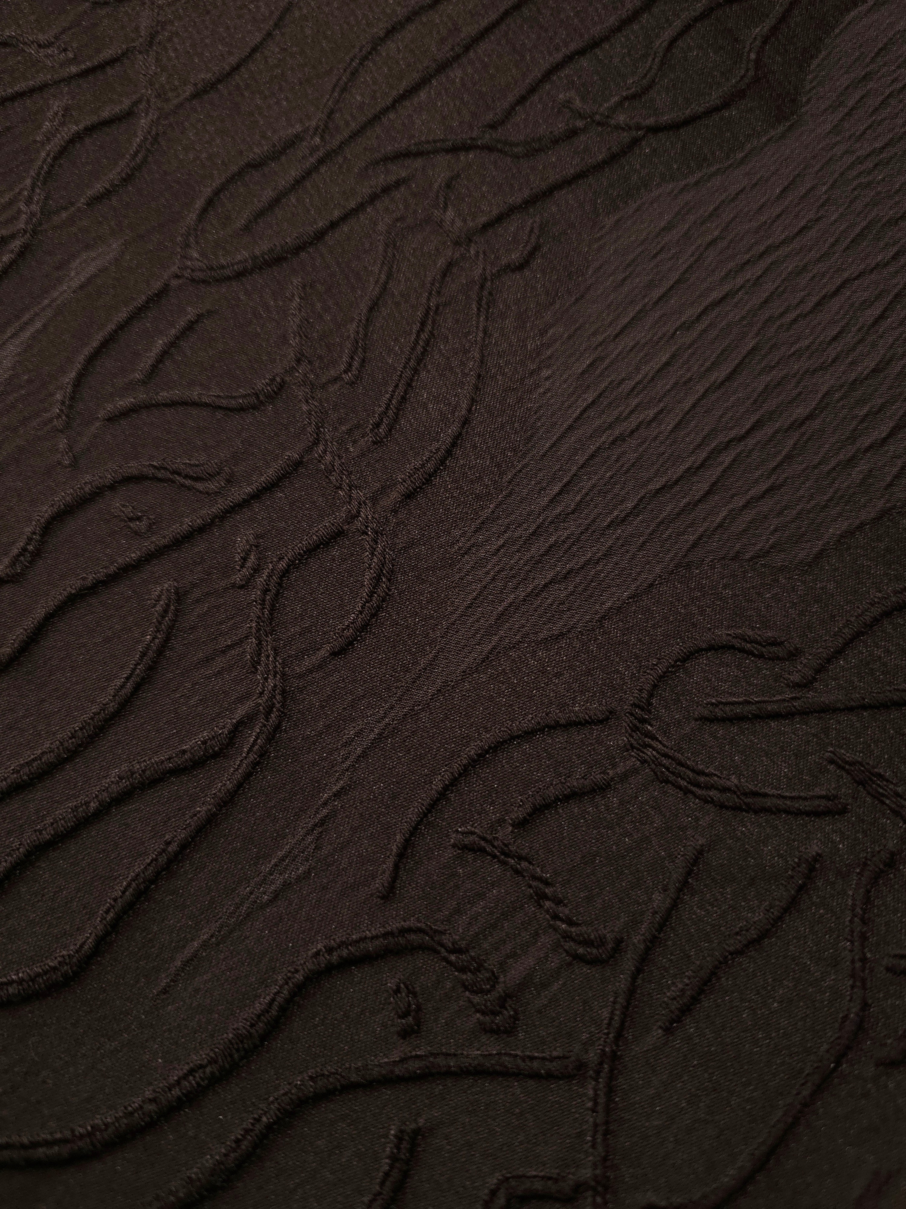 Drape view of brown laurel polyester crepe jacquard fabric for dresses, skirts and jackets.