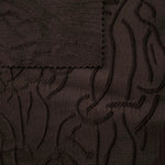 Full view of brown laurel polyester crepe jacquard fabric with tonal raised texture.