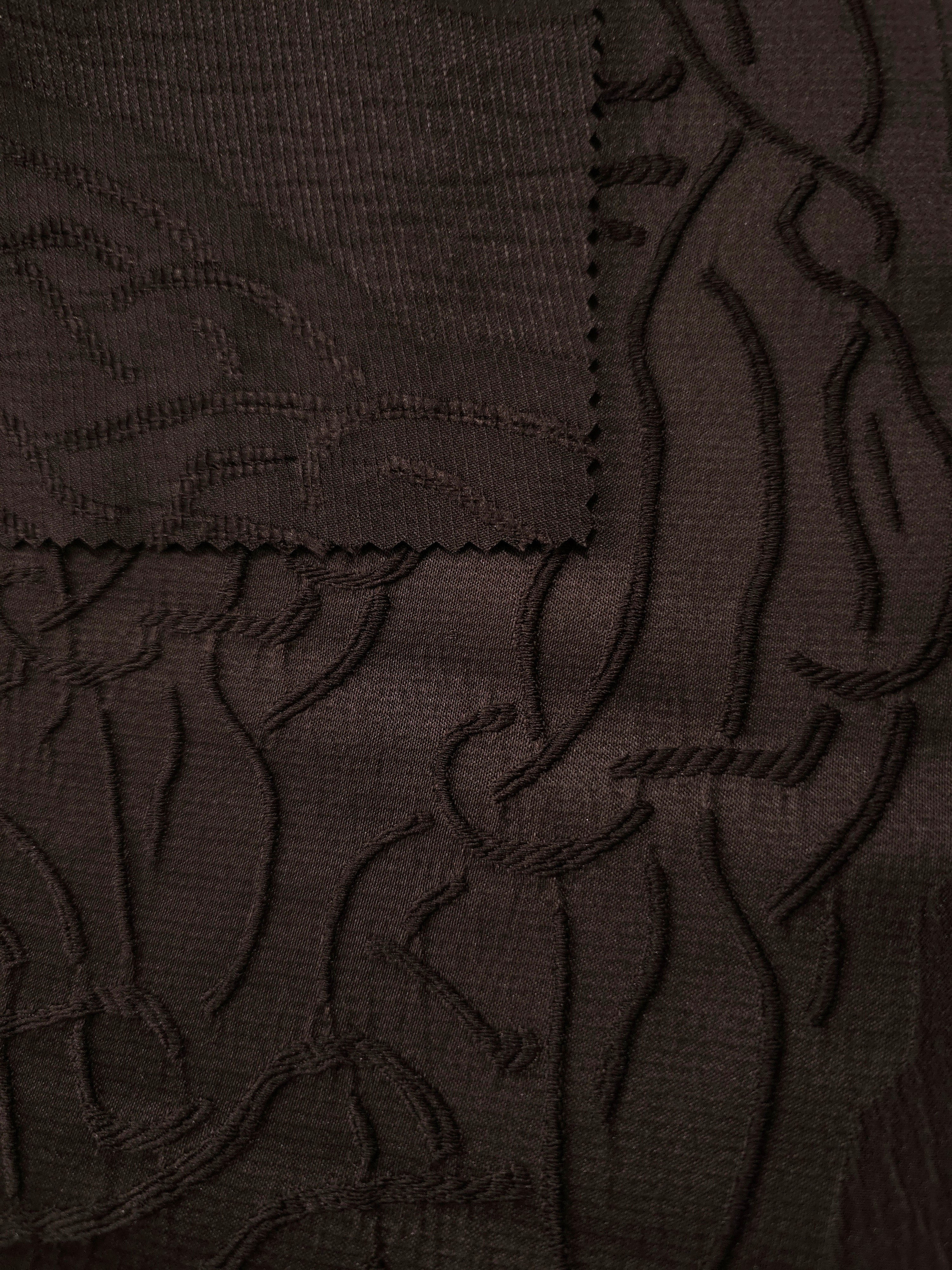 Full view of brown laurel polyester crepe jacquard fabric with tonal raised texture.
