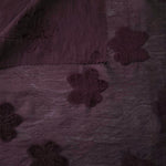 Front and back view of dark burgundy flower embossed viscose jacquard fabric.