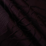 Wide view of burgundy laurel polyester crepe jacquard fabric for occasionwear layers.