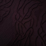 Drape view of burgundy laurel polyester crepe jacquard fabric for dresses and skirts.