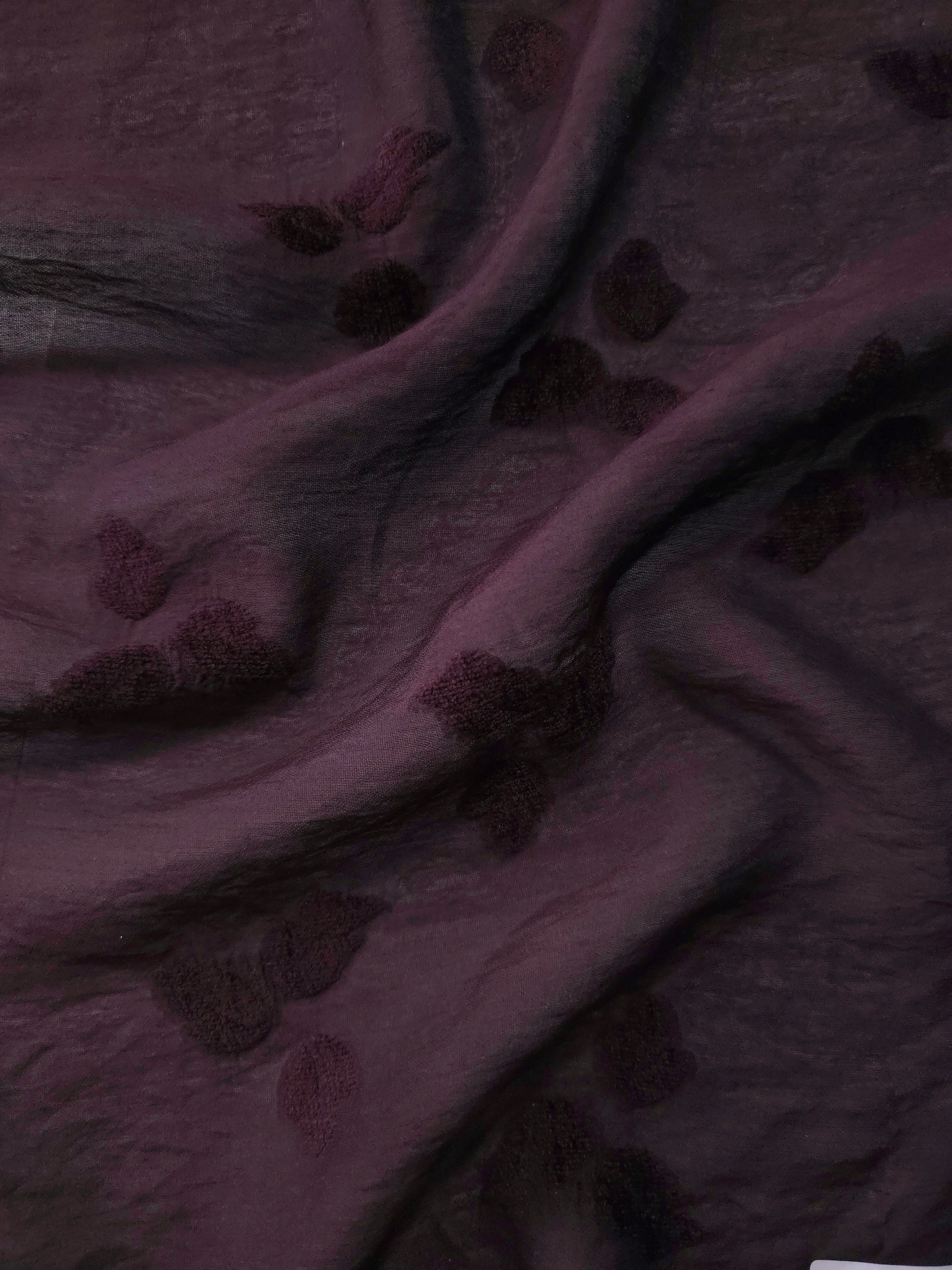 Pattern detail of dark burgundy small leaf embossed viscose jacquard fabric.