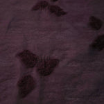 Front and back view of dark burgundy small leaf embossed viscose jacquard fabric.