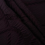 Burgundy wheat leaf polyester crepe jacquard fabric in a textured drape for dresses.
