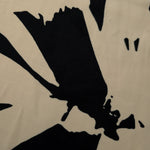 Close-up of navy blue printed rayon chiffon showing large floral Empirme pattern.