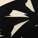 Close-up of brown printed rayon chiffon showing large floral Empirme pattern.