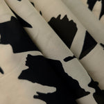 Folded navy blue rayon chiffon Empirme with big flower print for dress layers.
