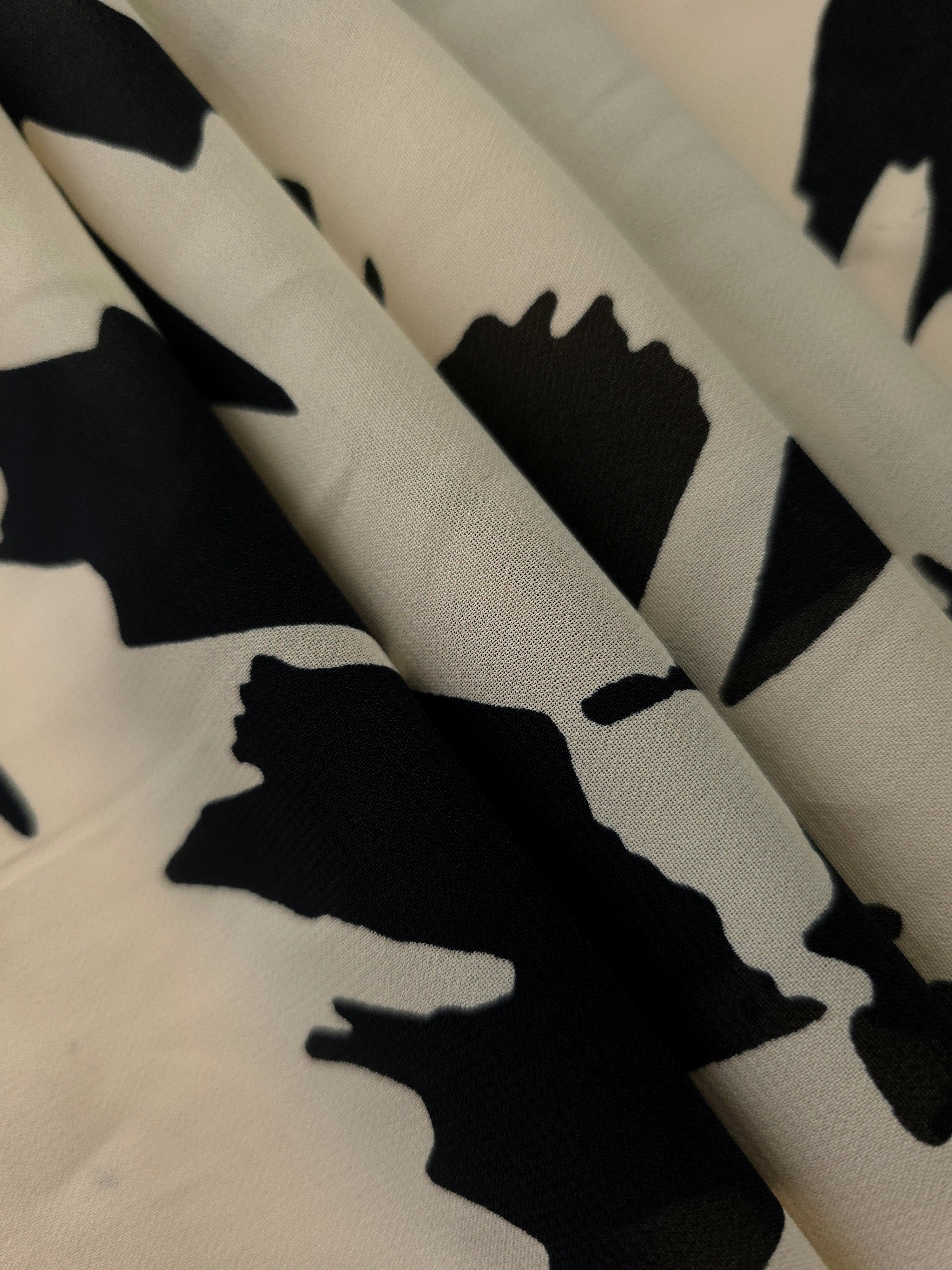 Folded navy blue rayon chiffon Empirme with big flower print for dress layers.
