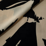 Front and back view of navy blue printed rayon chiffon for lining decisions.