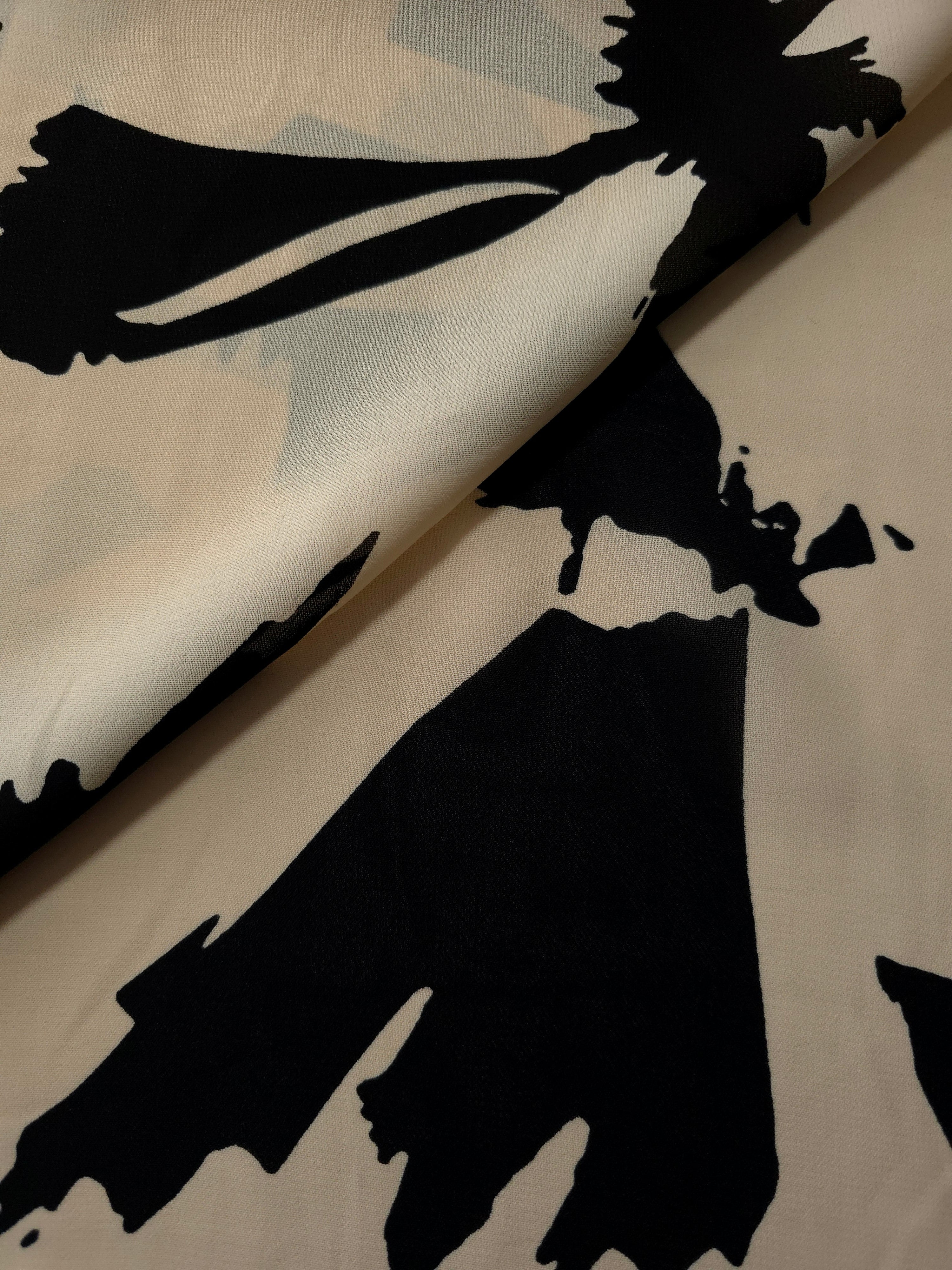 Front and back view of navy blue printed rayon chiffon for lining decisions.