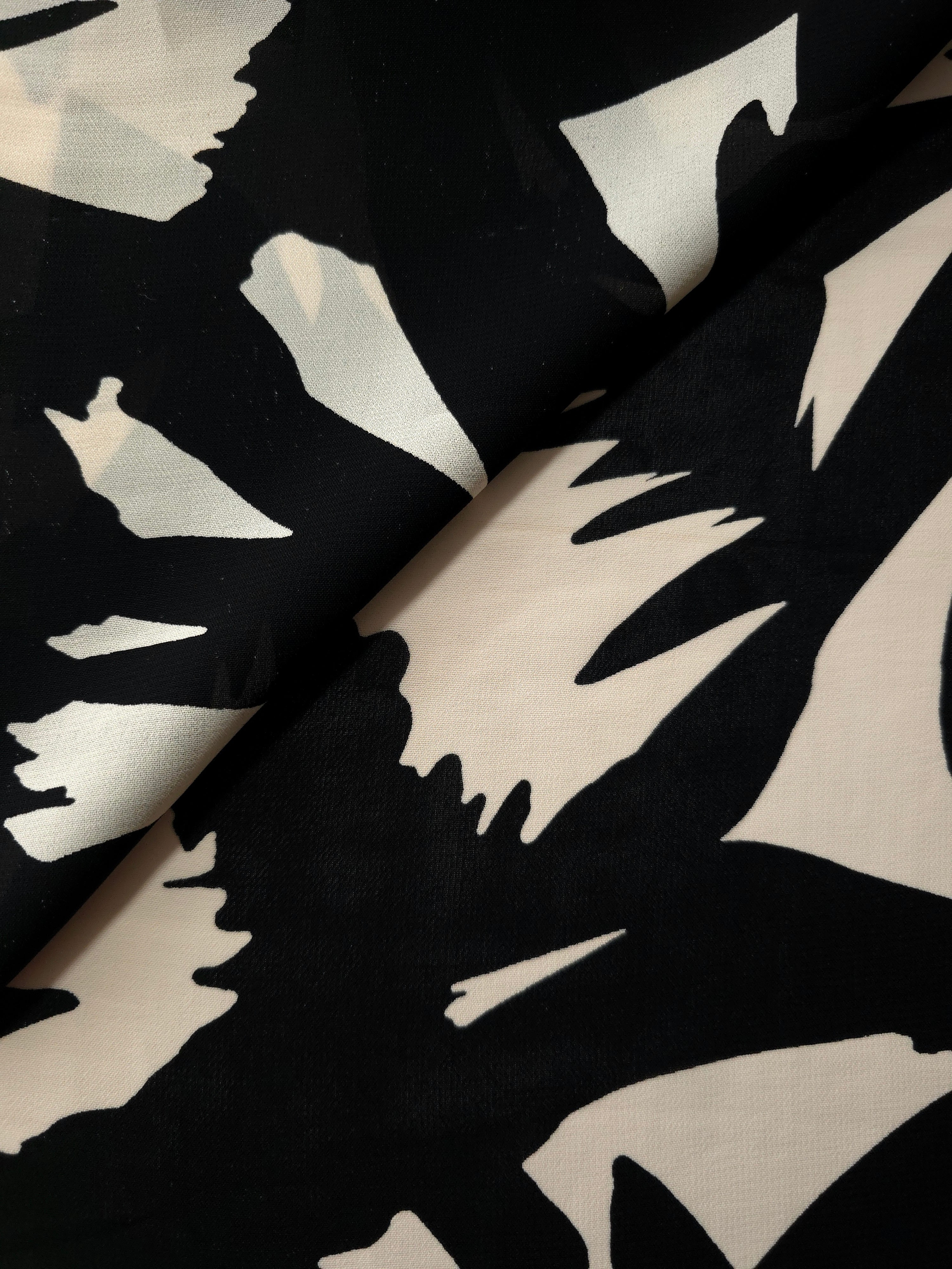 Front and back view of brown floral rayon chiffon for lining and opacity checks.