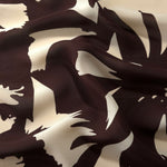 Wave fold of white rayon Empirme fabric with big flower print for summer layers.