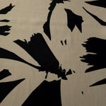 Wide view of navy blue floral rayon chiffon fabric for dresses and blouses.