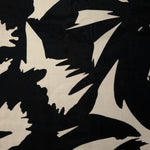 Wide view of brown floral rayon chiffon fabric by the meter for dressmaking.
