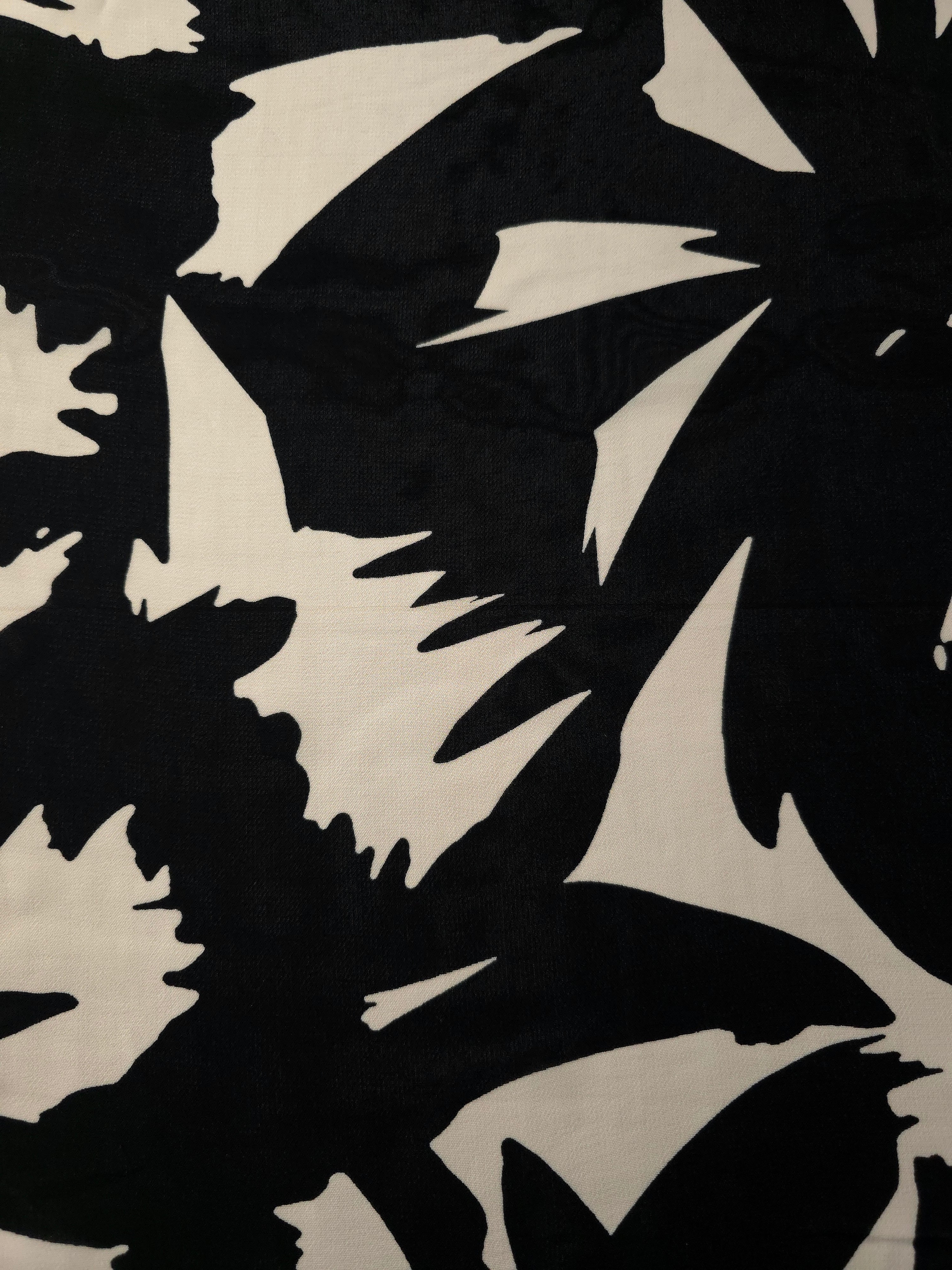 Wide view of brown floral rayon chiffon fabric by the meter for dressmaking.