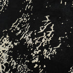 Close-up of white printed rayon chiffon showing graphic Empirme pattern and soft hand.