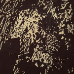 Close-up of brown printed rayon chiffon showing graphic pattern and light weave.