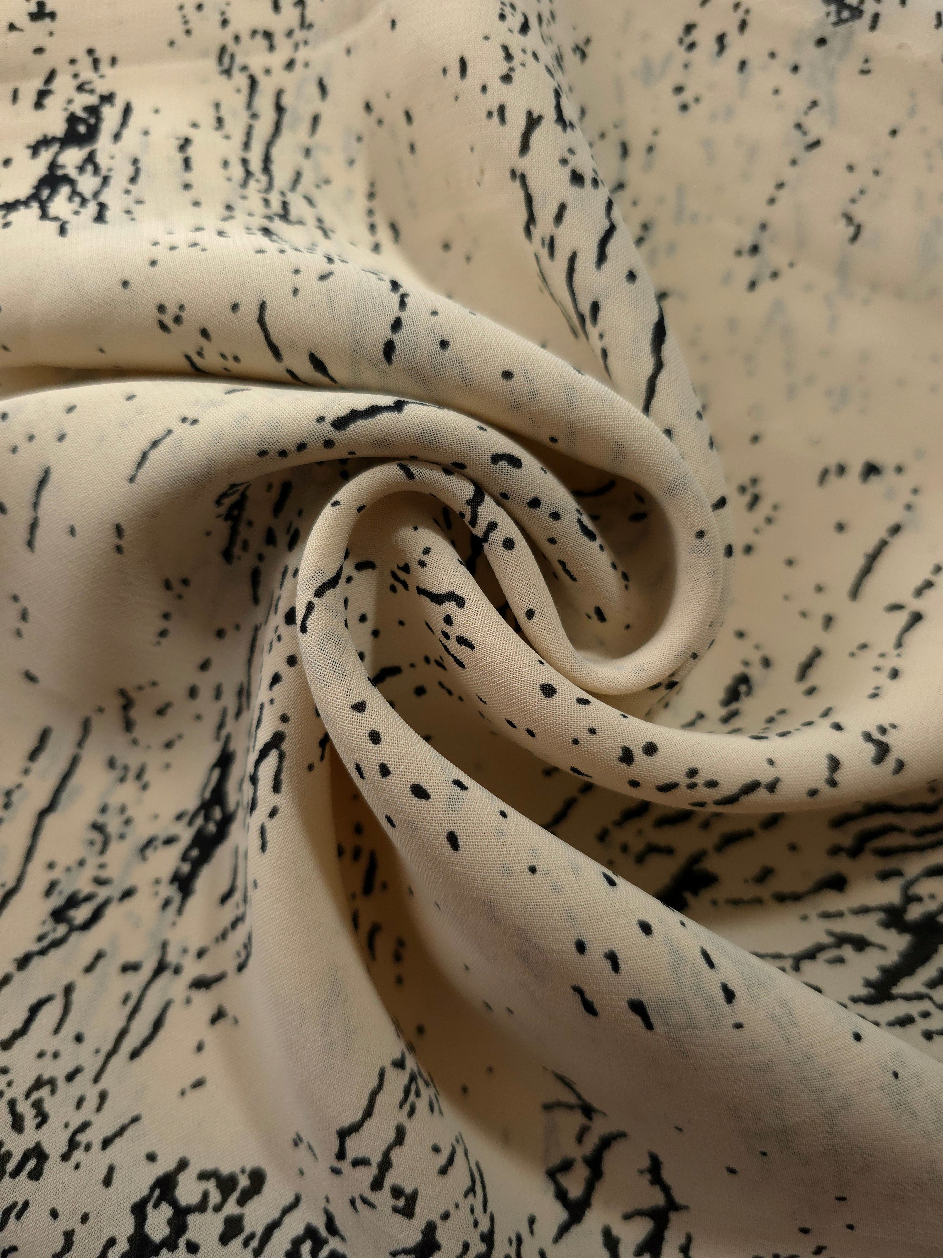Draped black chiffon rayon Empirme showing soft movement for kaftans and dresses.