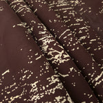Folded brown rayon chiffon Empirme with graphic print for soft dresses and layers.