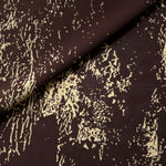 Front and back view of brown printed rayon chiffon for opacity and lining checks.