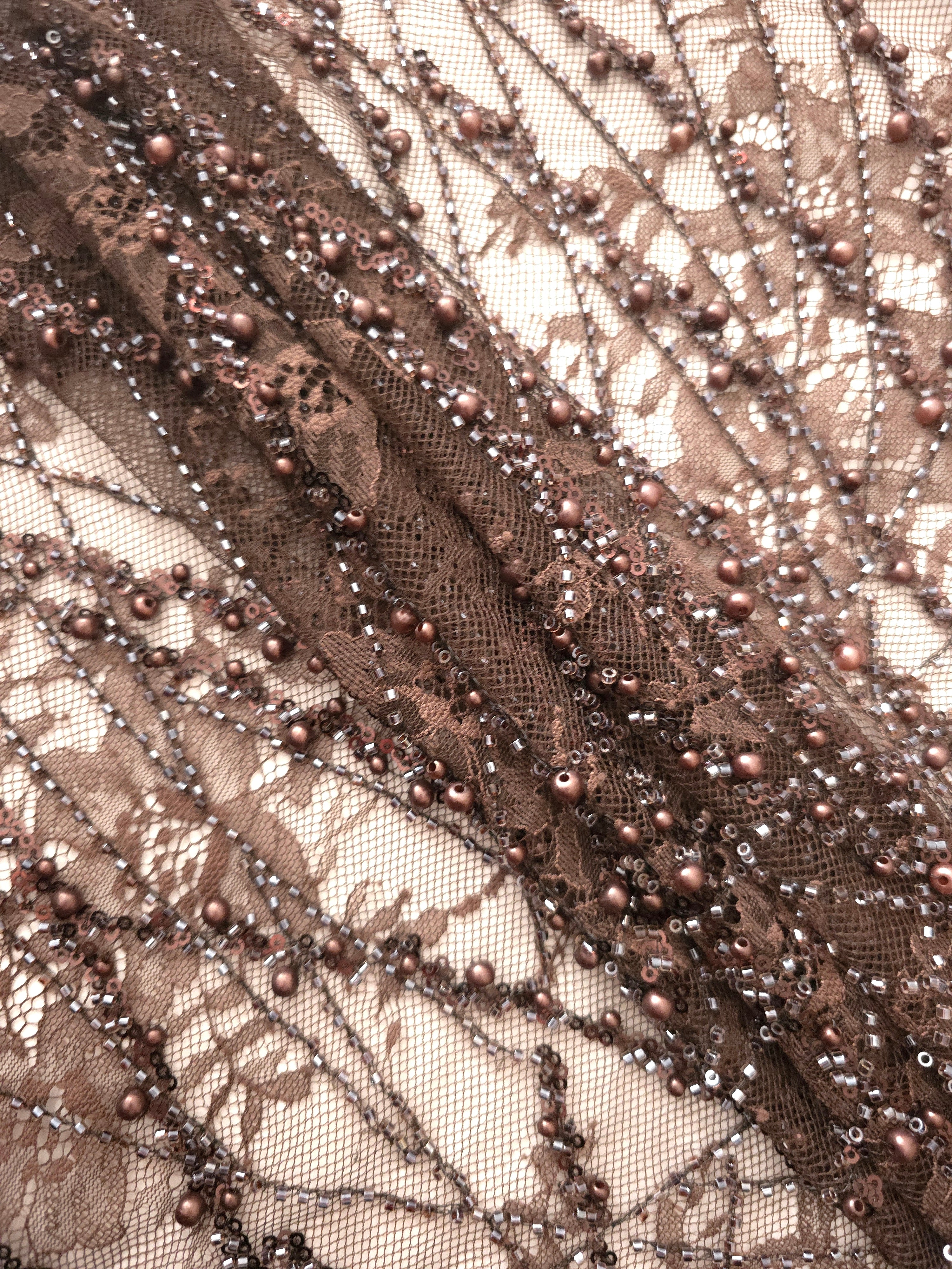 Close-up of Antique Bronze Botanical Pearl beaded lace showing raised pearl embroidery closeup, with branching botanical vines with pearl-like beading.