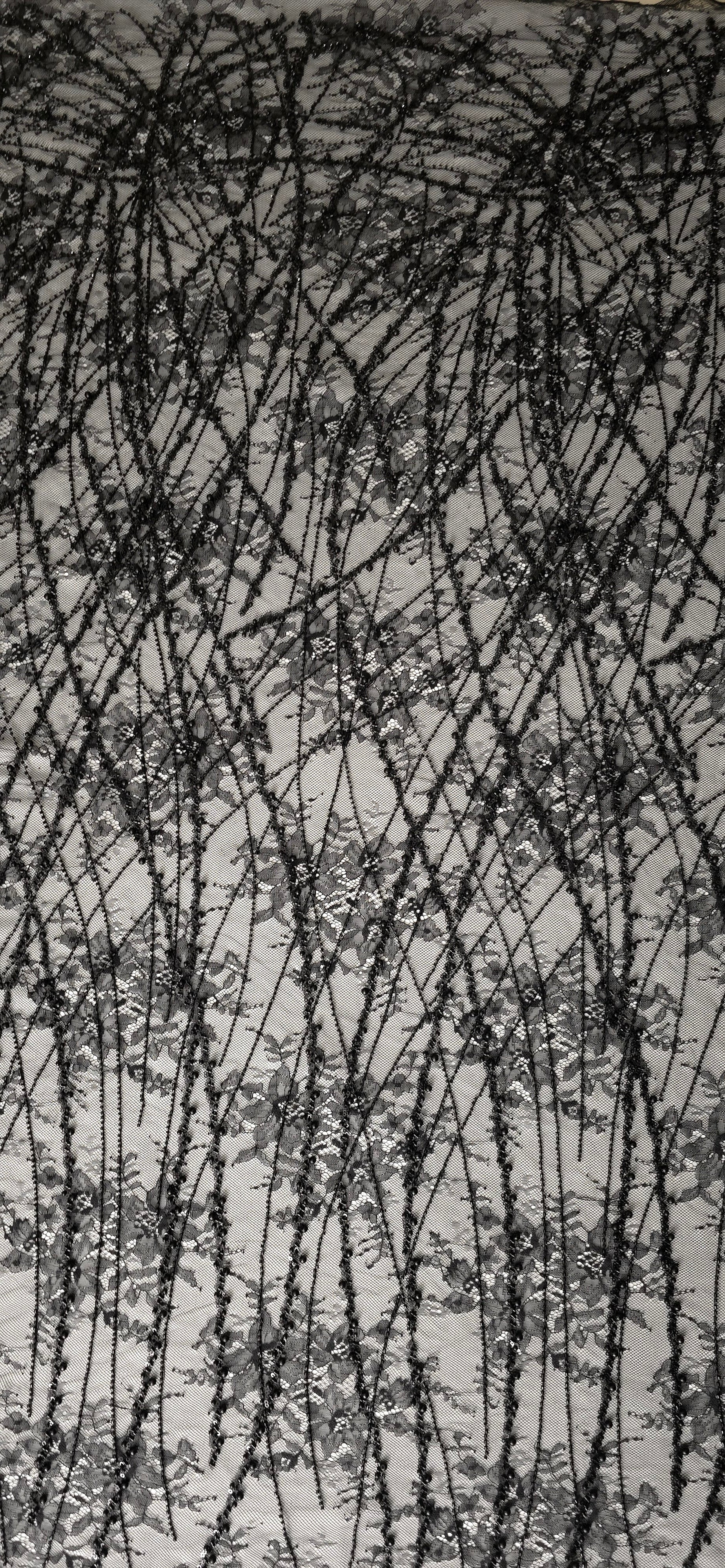 Jet Black Botanical Pearl couture lace in a draped embellished netting presentation, highlighting branching botanical vines with pearl-like beading.