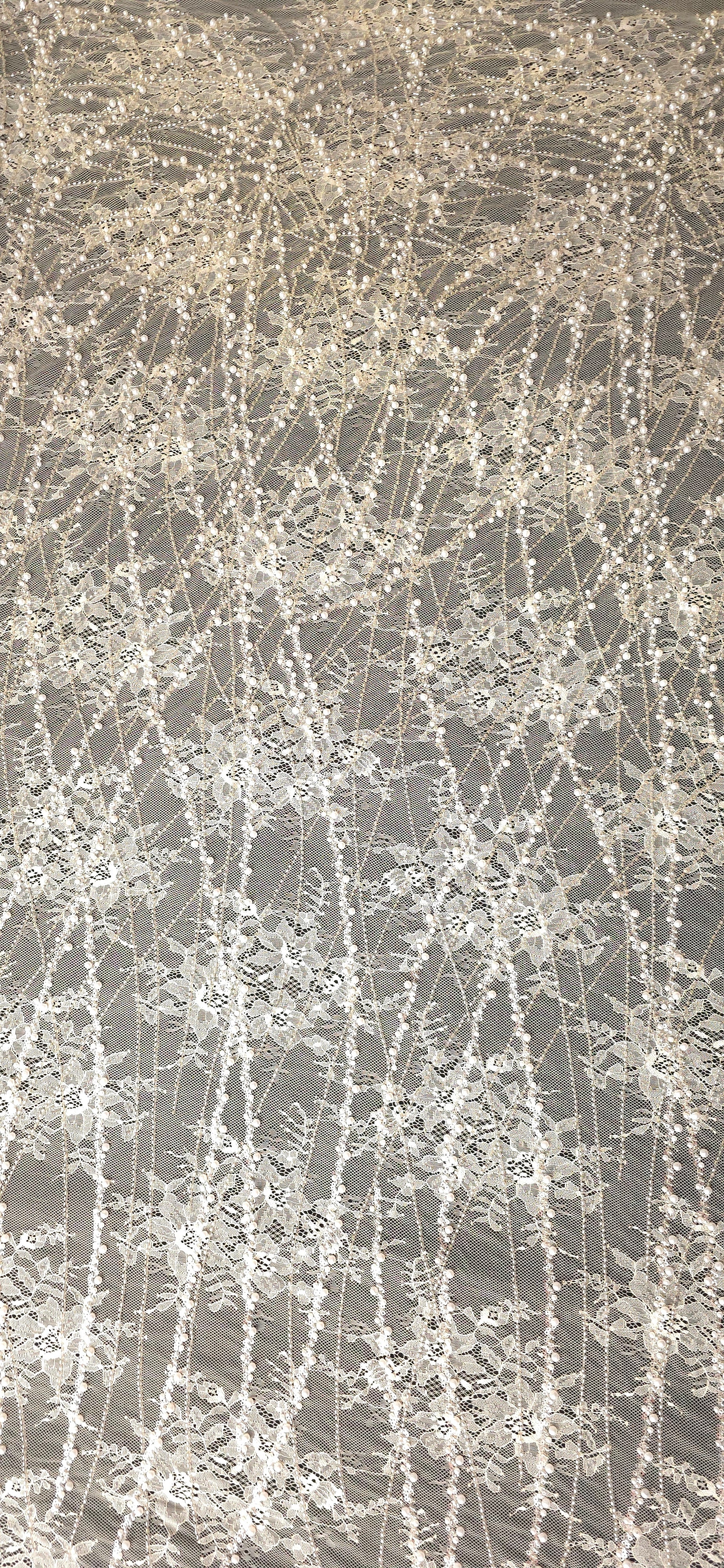 Pearl White Botanical Pearl embellished lace displaying contrast backdrop embroidered mesh, with branching botanical vines with pearl-like beading.