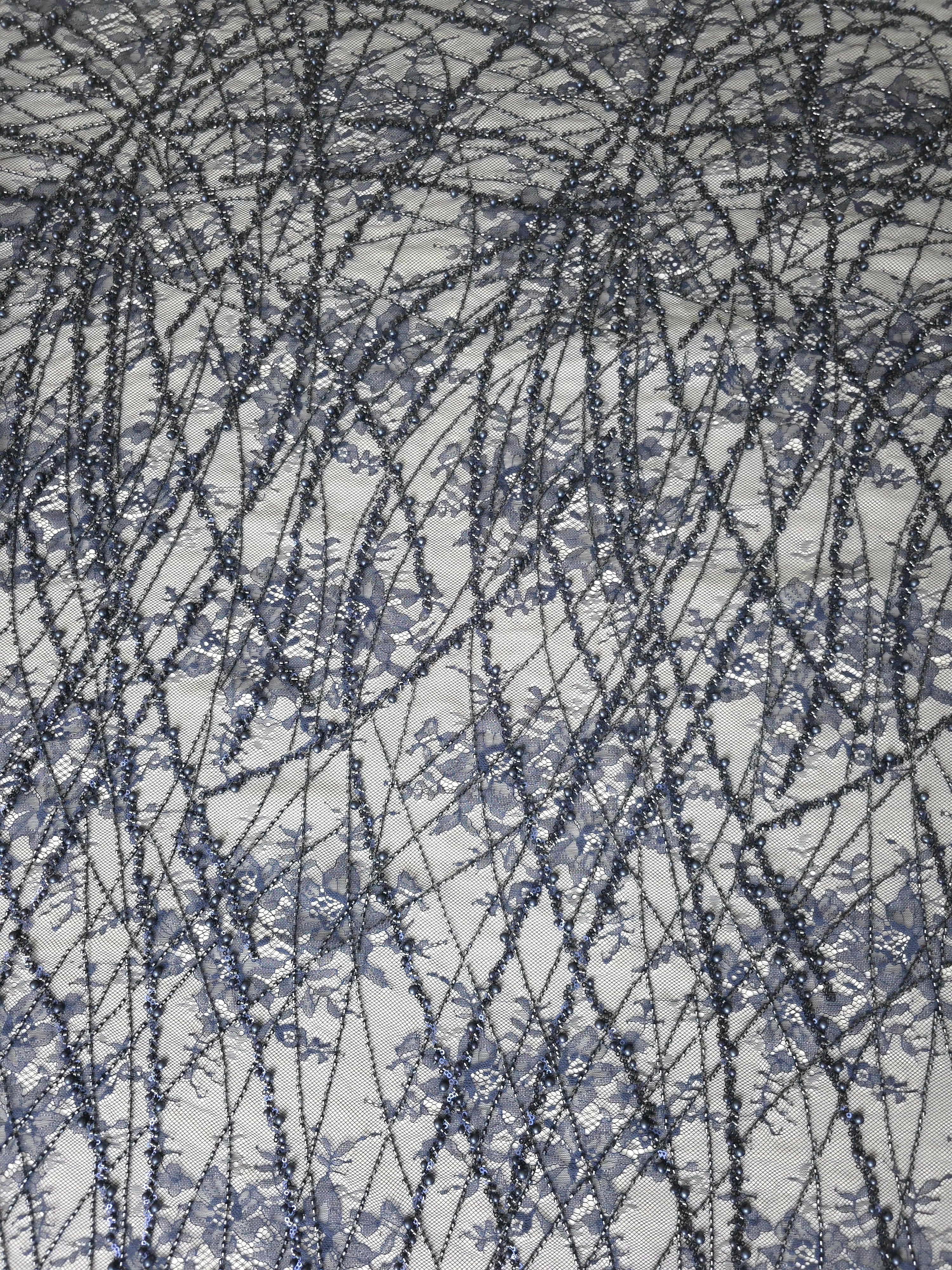 Close-up of Slate Blue Botanical Pearl beaded lace showing fine embellished texture, with branching botanical vines with pearl-like beading.