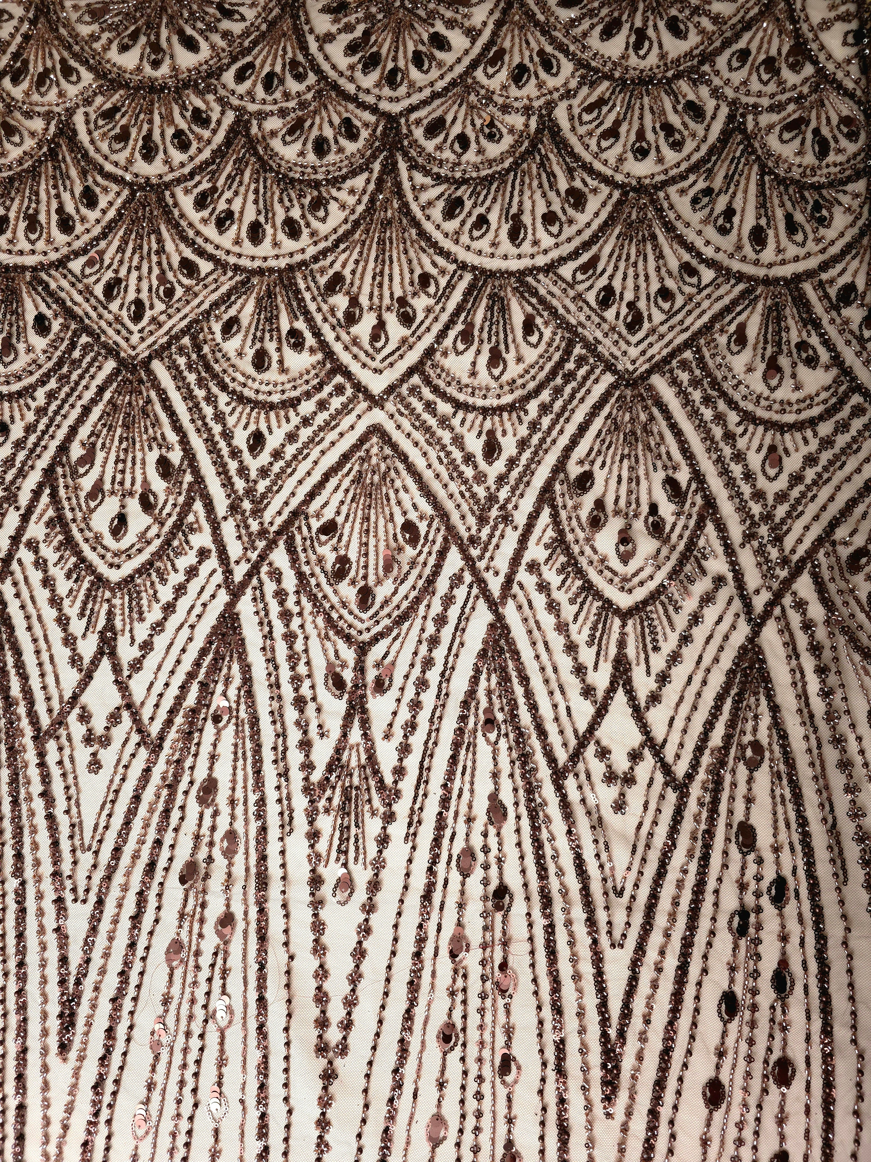 Antique Bronze Art Deco Cascade embroidered lace showing geometric fan motif repeat across a decorative mesh with cascading ornamental details and Deco-inspired beadwork.