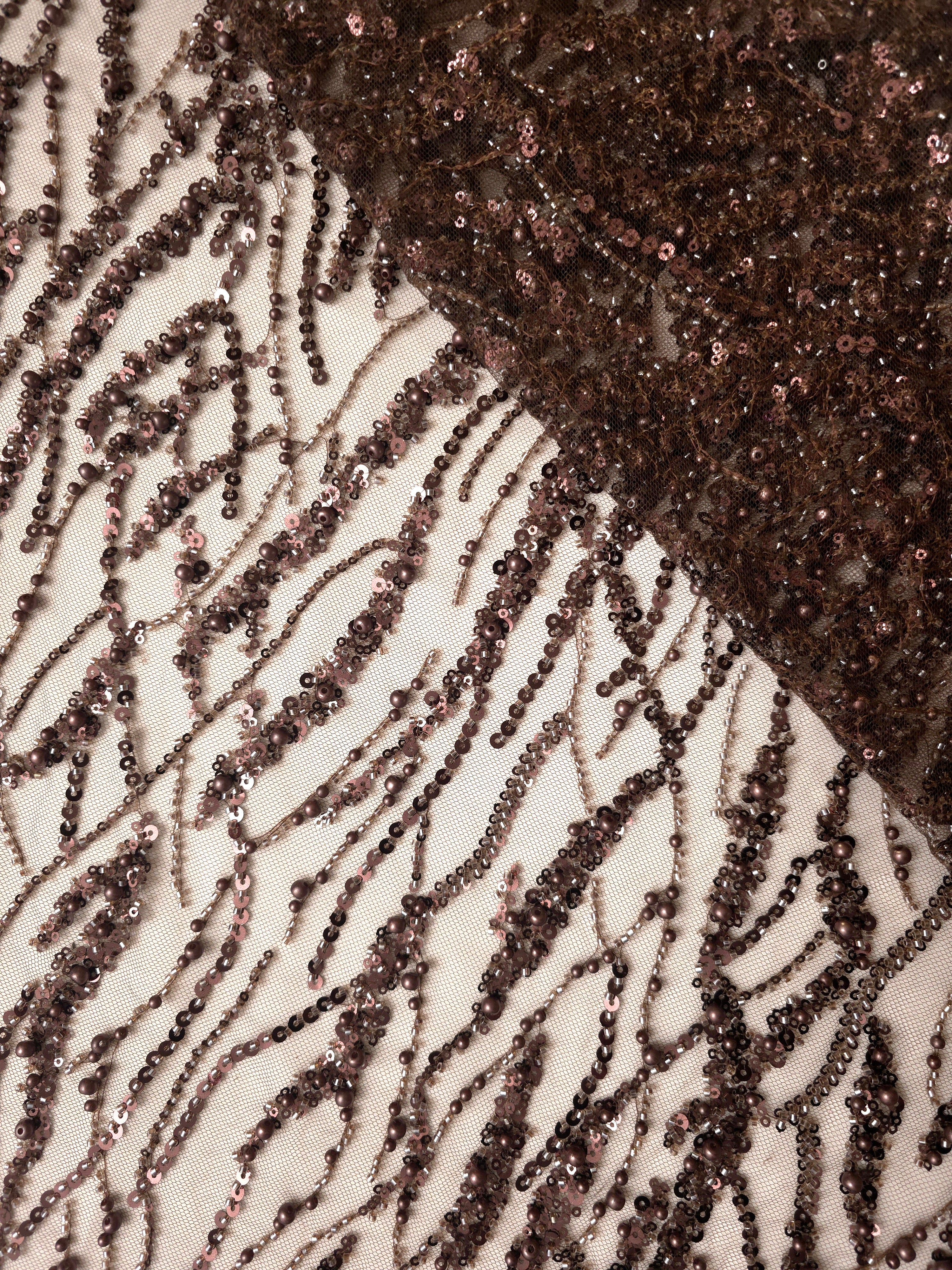 Close-up of Antique Bronze Liquid Wave beaded lace showing reflective threadwork folds, with flowing ripples and curved sequin embellishment.