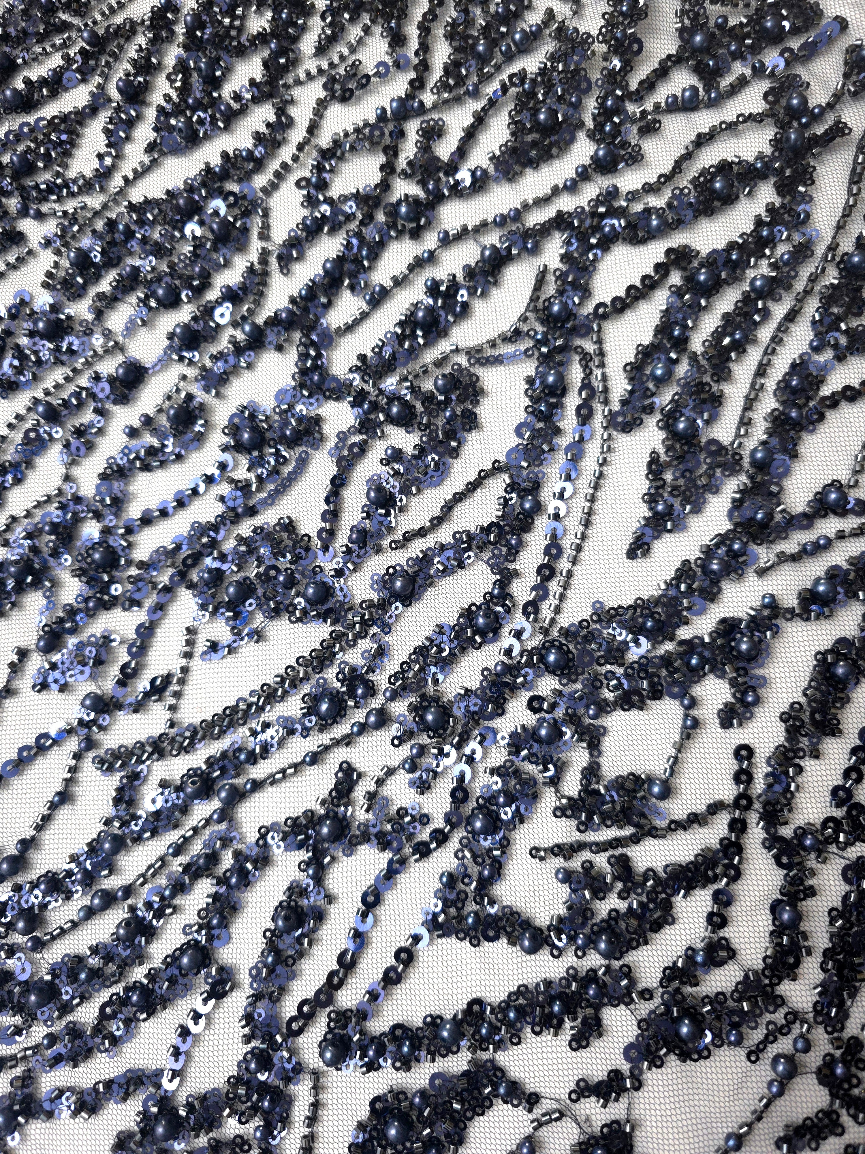 Close-up of Midnight Blue Liquid Wave beaded lace showing curving sequin threads closeup, with flowing ripples and curved sequin embellishment.
