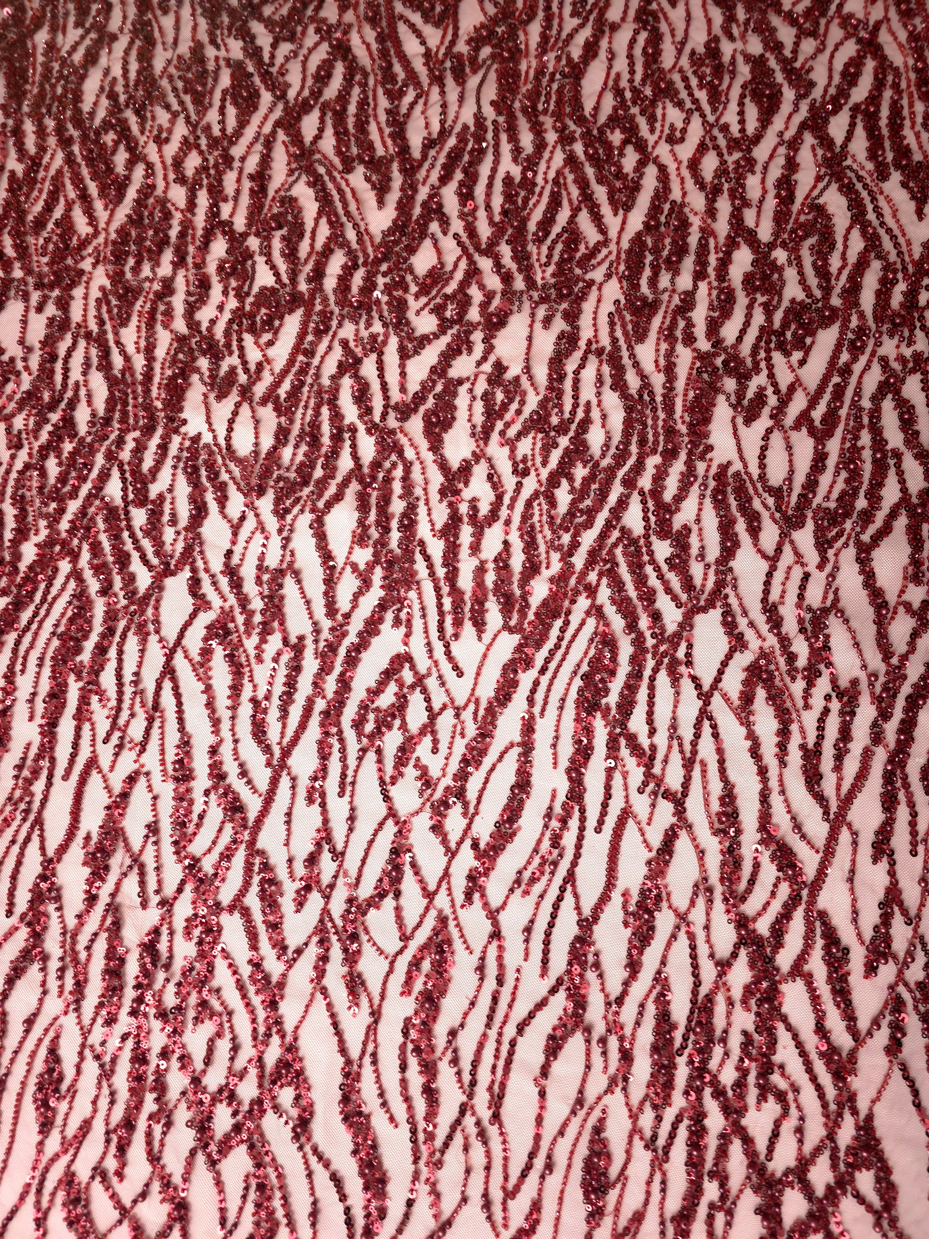 Wine Burgundy Liquid Wave embroidered lace showing abstract ripple motif repeat across a decorative mesh with flowing ripples and curved sequin embellishment.