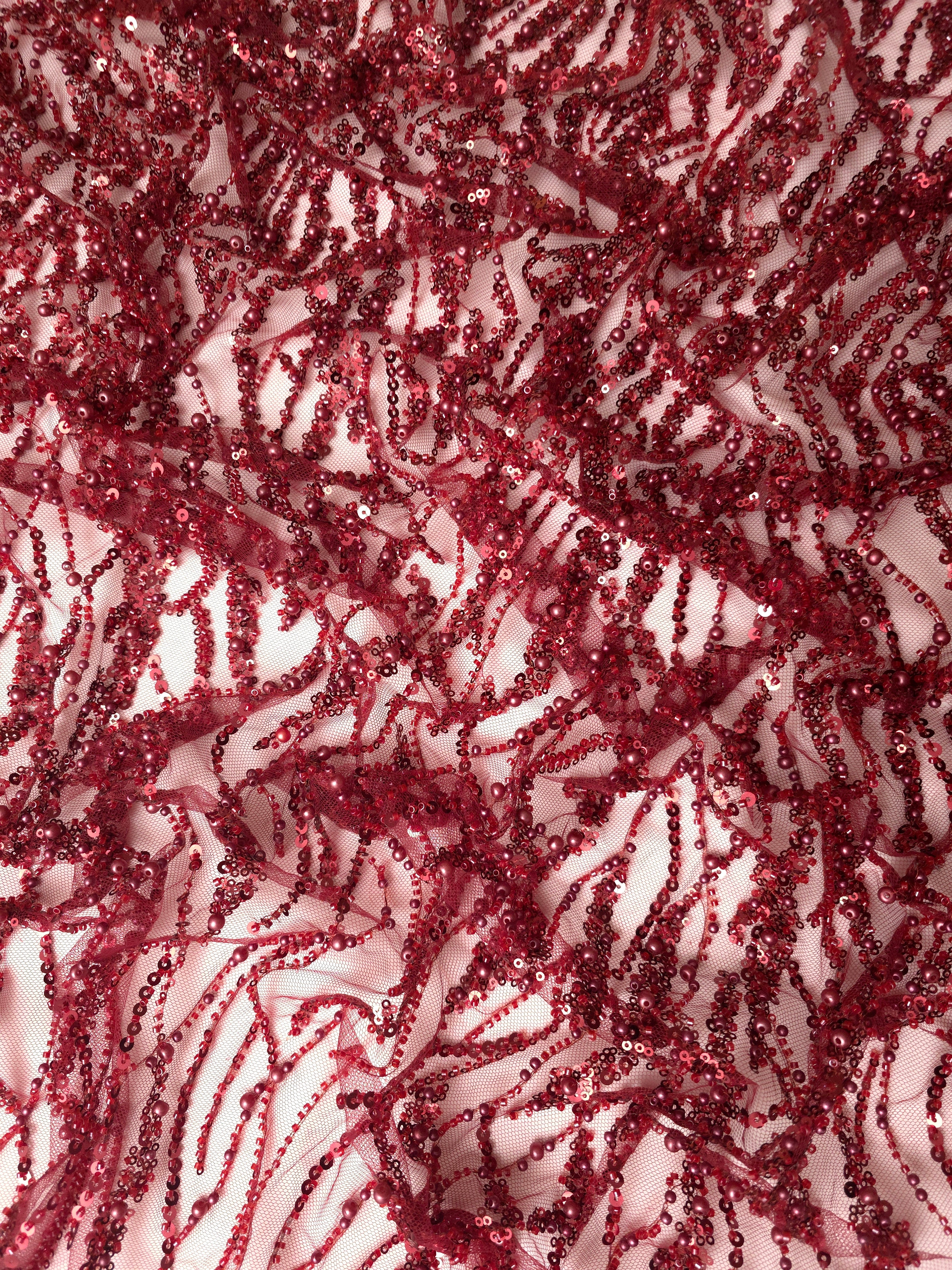 Wine Burgundy Liquid Wave embellished lace displaying embellished sheer overlay, with flowing ripples and curved sequin embellishment.