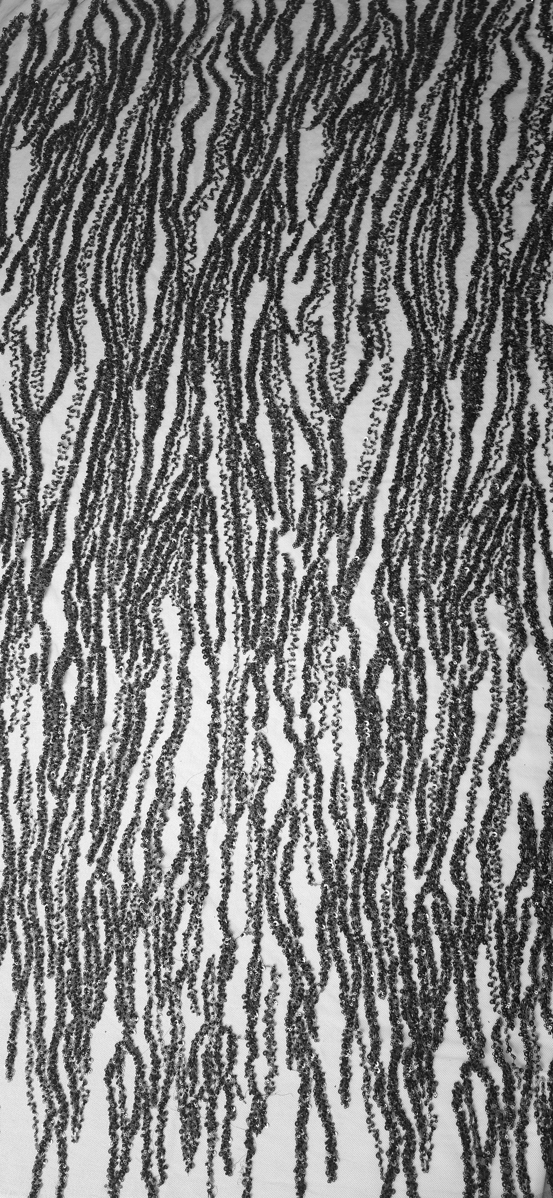 Tall panel of Onyx Black Zebra Strata beaded lace showing elongated black zebra-like lines on transparent net.