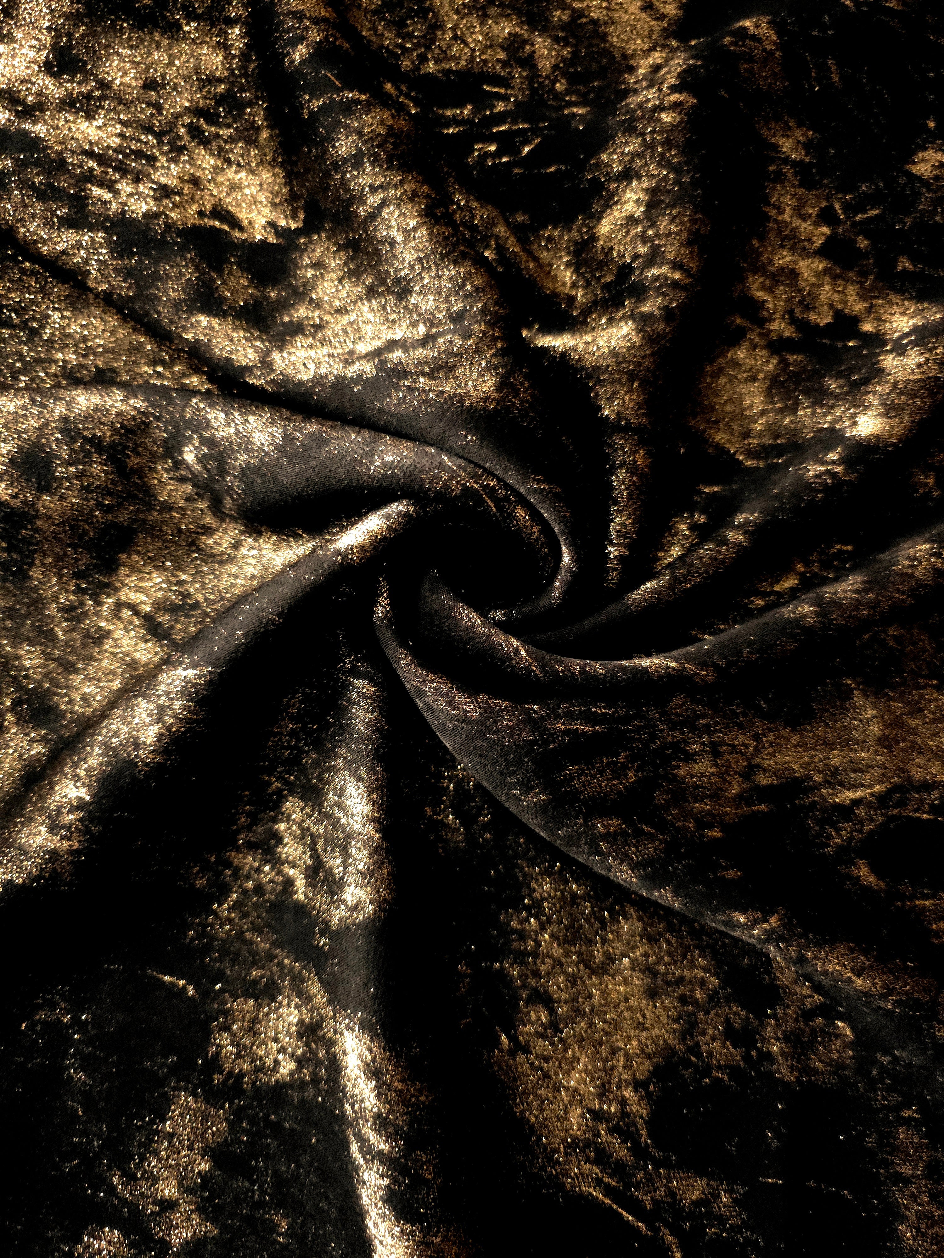 Rosette drape of Antique Gold Lurex Italiano fabric emphasizing shimmer for kaftans and occasionwear.