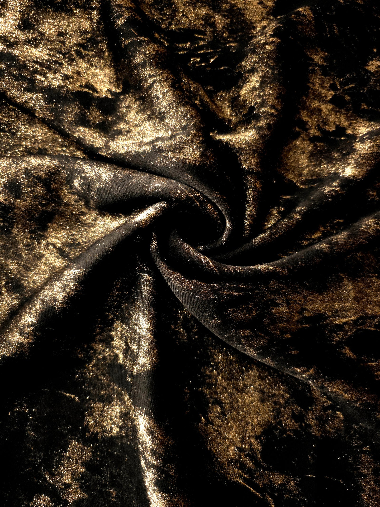 Rosette drape of Antique Gold Lurex Italiano fabric emphasizing shimmer for kaftans and occasionwear.