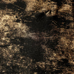 Macro close-up of Antique Gold Lurex Italiano fabric revealing metallic texture for designer apparel.