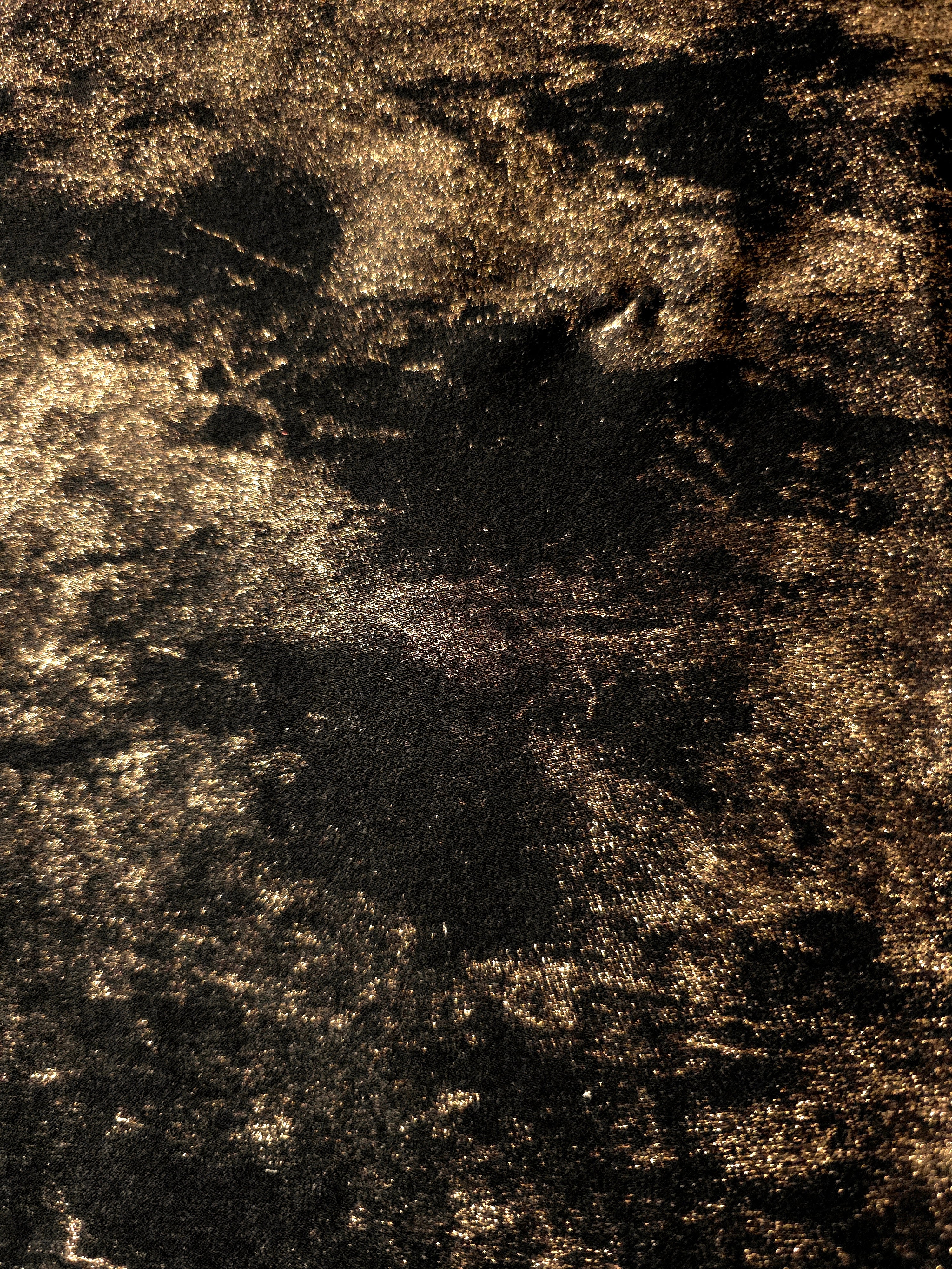 Macro close-up of Antique Gold Lurex Italiano fabric revealing metallic texture for designer apparel.