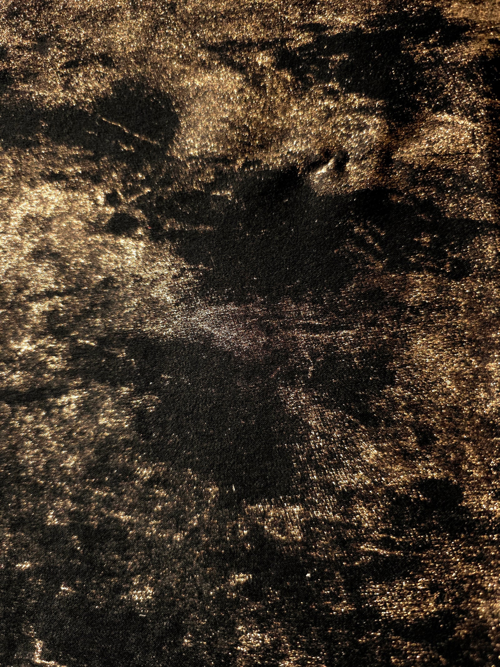 Macro close-up of Antique Gold Lurex Italiano fabric revealing metallic texture for designer apparel.