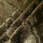 Rosette drape of Antique Khaki Lurex Italiano fabric emphasizing shimmer for kaftans and occasionwear.