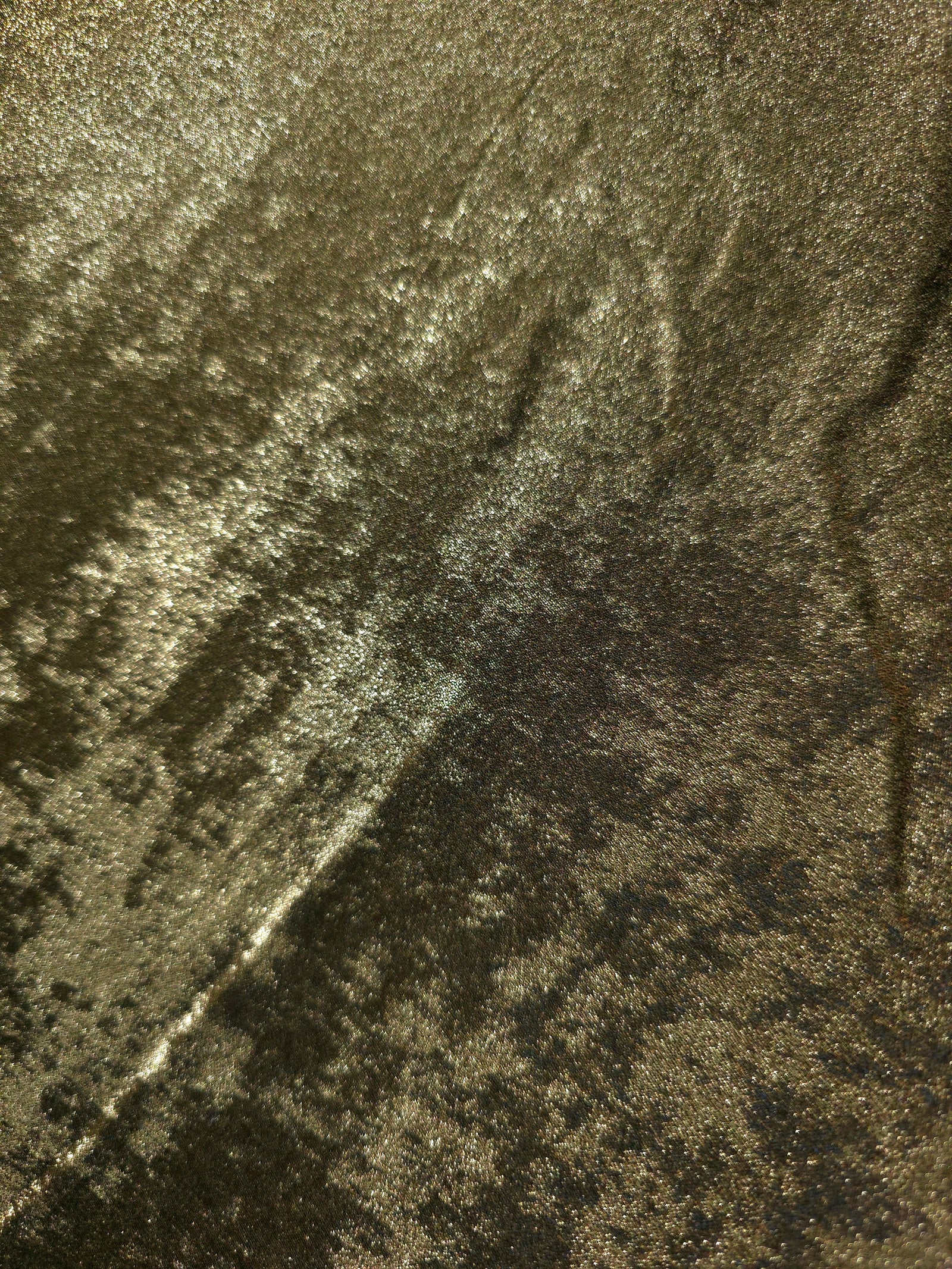 Macro close-up of Antique Khaki Lurex Italiano fabric revealing metallic texture for designer apparel.
