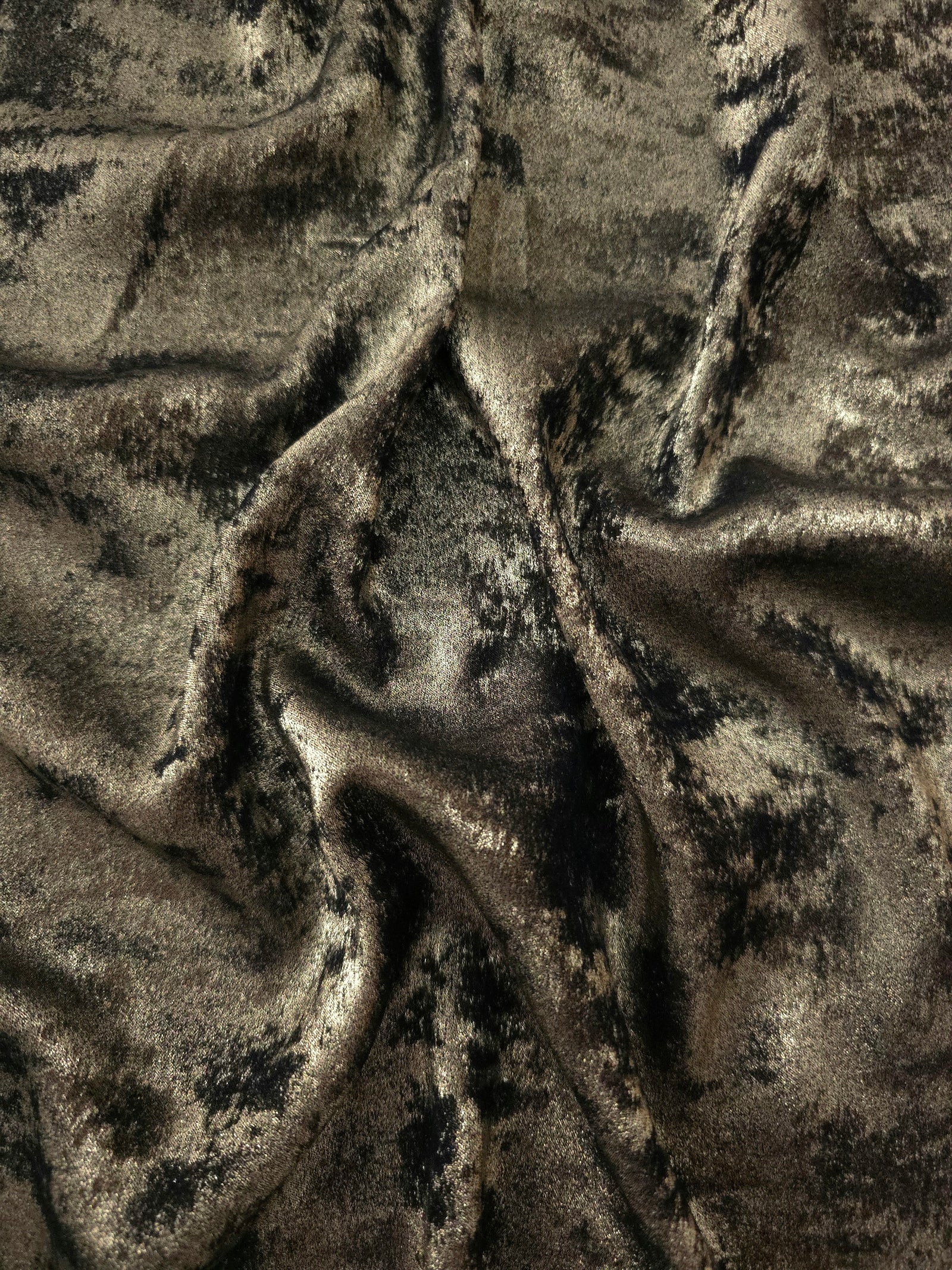 Flowing folds of Antique Olive Lurex Italiano fabric highlighting drape for abayas, kaftans and dresses.
